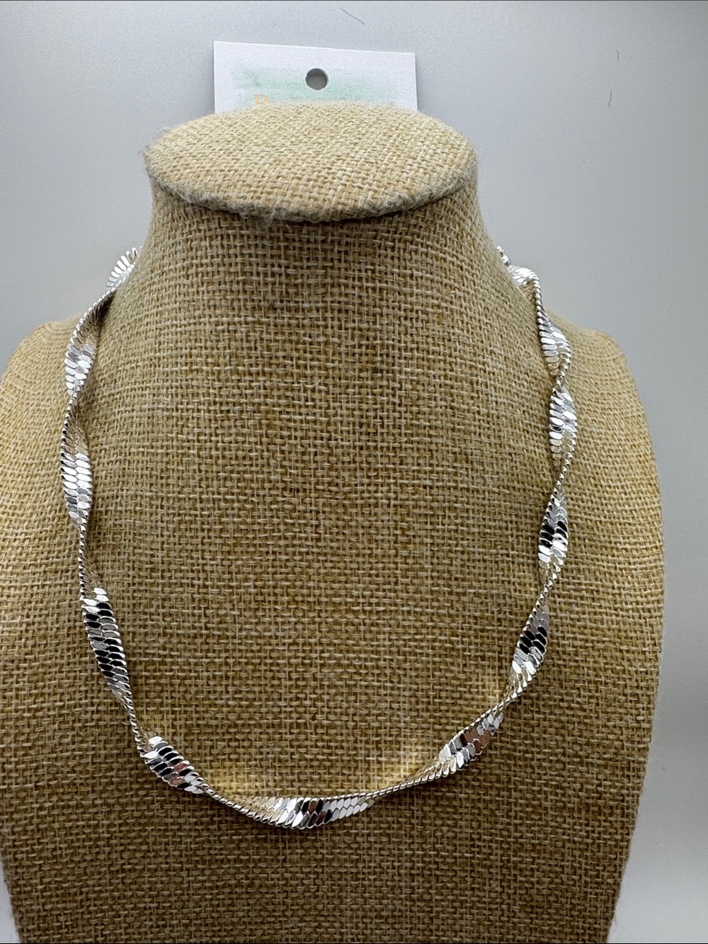Silver tone twisted necklace